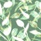 Spring floral seamless pattern with silhouettes of tulips on green.