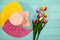 Spring flower of multi color Tulips and summer lady hat on wood copy space space for your text