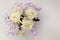 Spring flowers, close-up of yellow, pale pink chrysanthemums and small lilac flowers on a soft calm empty background