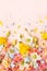 Spring Flowers composition on pastel pink background. Floral concept for Easter, Woman`s day or Valentine`s day