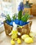 Spring flowers in a small basket and easter rabbit