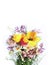 Spring flowers-tulips, daffodils, chrysanthemums and lilies of the valley on a light pink background.