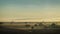 Spring foggy dawn in the steppe. Panorama of a wide valley