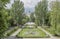 In the spring Gorky Park citizens walk and rest on the benches