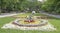 In the spring Gorky Park citizens walk and rest on the benches