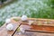 Spring hailstorm in the garden - huge hailstones and chipped plant parts on a wet garden table