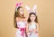 Spring holiday. Happy childhood. Easter day. Easter activities for children. Happy easter. Holiday bunny girls with long