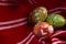 Spring holiday and happy easter concept with three dyed eggs in a rustic vintage red cloth with each egg having different complex