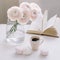 Spring home decor. Book, flowers and coffee cup in morning light. Good morning concept. Interior design of room