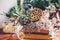 Spring home decor. Bouquet of dried flowers and heap of books on the wooden desk.