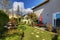 Spring house back yard with red chairs