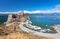 Spring landscape of Baikal Lake with naturl landmark of Olkhon Island - Shamanka Rock during the ice drift