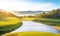 Spring landscape morning in valley with green meadow on hills, orang and blue sky, Spring panorama view by the river,