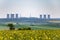 Spring landscape with nuclear power plant on horizon
