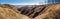 Spring landscape, panorama, banner - spurs of ravine near the flooding winding river over the meadows between hills and forests