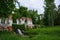 Spring landscape with pavilion Ruins, pond and waterfall. Park `Oleksandriya` in Bila Tserkva, Ukraine.