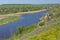 spring landscape with rocky Sura riverside and summer cottages near Dnipro city, Ukraine