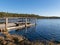 Spring landscape with wooden viewing platform on the lake