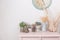 Spring mood. Vintage interior decoration. pink pastel closet. Dry anf fresh flowers on wooden table. A large clock on a