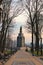 Spring morning landscape view of the Monument of Volodymyr The Great. Straight stone walkway in the park. Saint Vladimir Hil