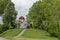 Spring panorama of a part of a residential district neighborhood with a church with modern architecture and belfry