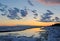 Spring panoramic view of the sunset sky and the Volga River, which is beginning to melt.