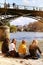 Spring in Paris Seine riverbanks near Pont des Arts friendship group