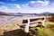 Spring photo of wooden bench on Doerellova vyhlidka view in Ceske stredohori in czech landscape with river Labe on background