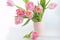 Spring pink tulips in a bouquet in a vase