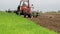 Spring planting corn in a field