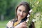 Spring portrait of a  woman with a flowering rose hip