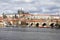 Spring Prague gothic Castle with the Lesser Town above River Vltava in the sunny Day, Czech Republic