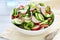 Spring salad with radish in bowl