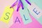 Spring sale, price tags on pastel background