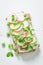 Spring sandwich with avocado, creamy cheese and peas