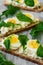 Spring sandwiches with cheese, eggs and rucola