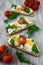 Spring sandwiches with cheese, eggs, tomatoes and rucola