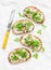 Spring sandwiches - grilled bread, cream cheese, green peas, radishes and micro greens. Healthy eating, slimming, diet lifestyle c