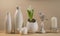 Spring Scandinavian cozy home decor: white vases, white hyacinth and bird figurines