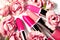 Spring set of lipsticks in pink flowers. Beauty cosmetic collection. Fashion trends in cosmetics, bright lips