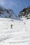 Spring ski touring and hiker approach on the mountain pass Zawrat in the Tatra Mountains.