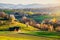 Spring in Slovakia. Meadows and fields landscape near Hrinova. Spring colored cherry trees at sunset