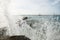 Spring stormy sea. Waves beat on a concrete pier