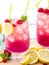 Spring or summer refreshing cold cocktail or mocktail with berries and lemon, raspberry lemonade