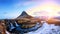 Spring sunrise over the famous Kirkjufellsfoss Waterfall with Kirkjufell mountain in the background in Iceland