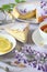 Spring tea: savoy sponge cake, flowering wisteria and lemon tea