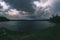 A spring thunderstorm over the river in the evening.