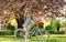 Spring time. girl flower seller with retro bike. vintage bicycle for pleasant walk in park. fashion woman enjoy spring