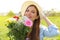 Spring time. Teenager girl holds flower bouquet outdoor