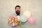 It is spring time. womens day. Formal mature businessman love date with flowers. Happy Birthday. bearded man in bow tie